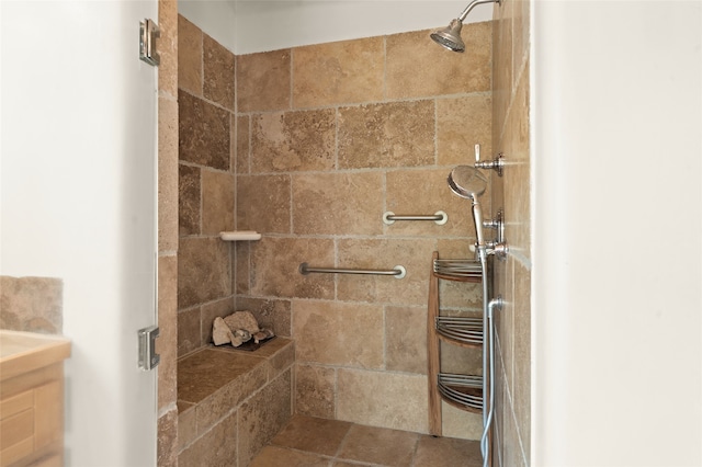 bathroom with a tile shower