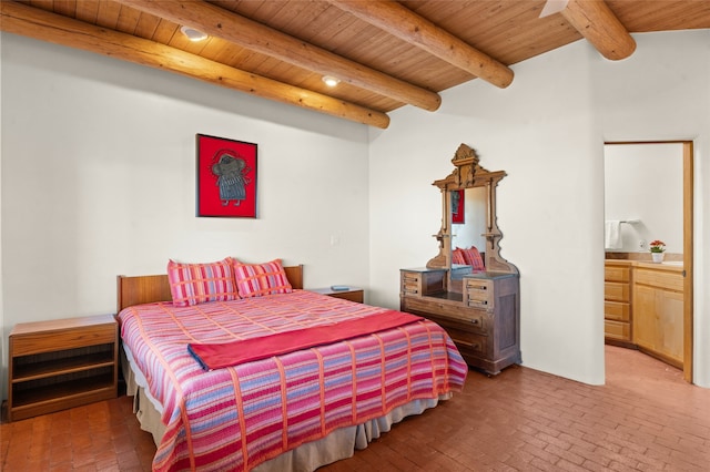 bedroom with wood ceiling, connected bathroom, and beamed ceiling