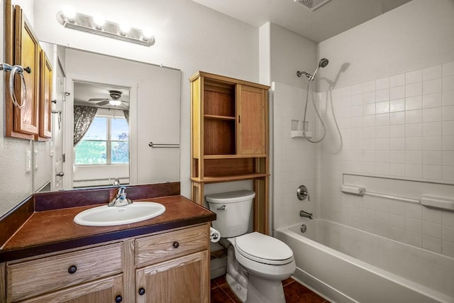 bathroom featuring visible vents, toilet, vanity, and bathtub / shower combination