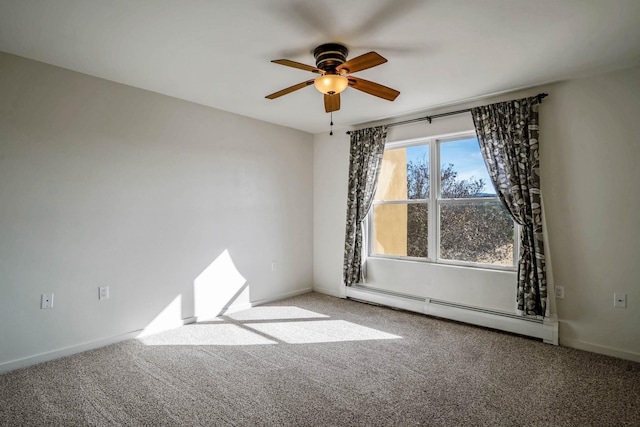 spare room with carpet, baseboards, and baseboard heating