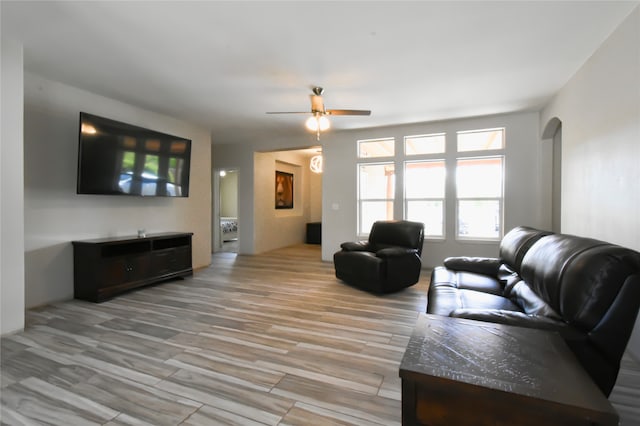 living room featuring hardwood / wood-style flooring and ceiling fan