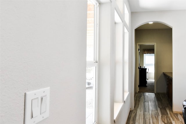 hallway with dark hardwood / wood-style floors