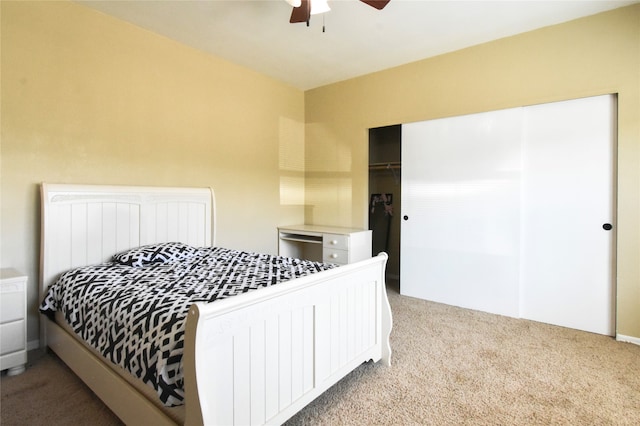 bedroom featuring a closet, ceiling fan, and carpet floors