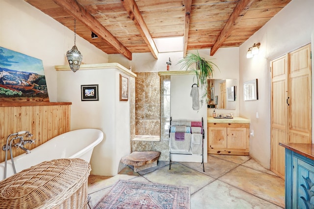 bathroom featuring concrete floors, a bath, wooden ceiling, vanity, and beam ceiling