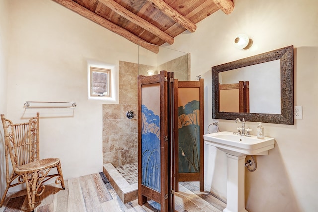 bathroom featuring a shower, vaulted ceiling with beams, hardwood / wood-style flooring, and wooden ceiling