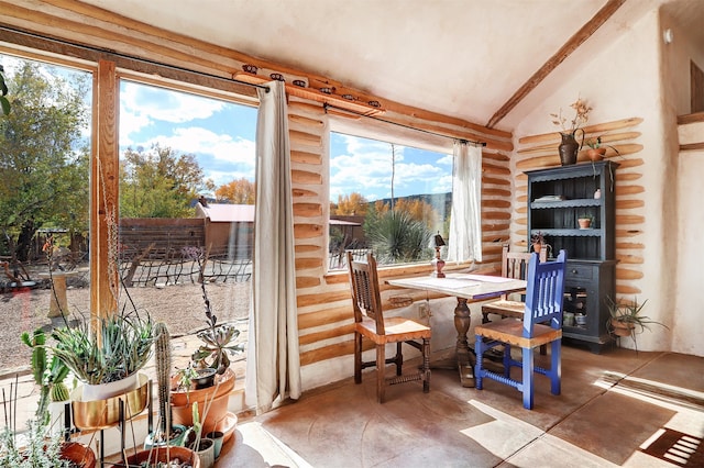 sunroom / solarium with lofted ceiling and plenty of natural light