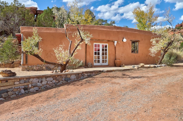 back of house featuring french doors