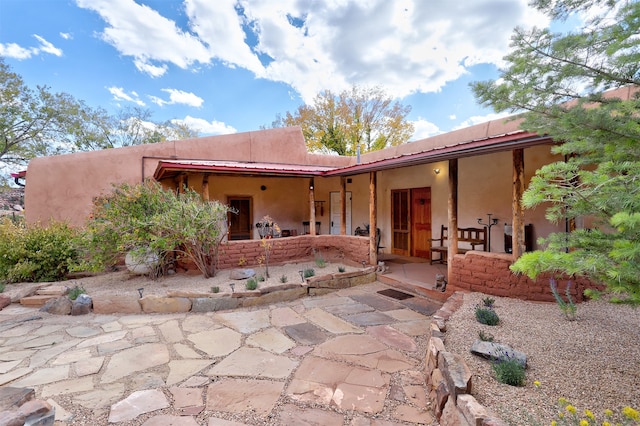 rear view of property with a patio area