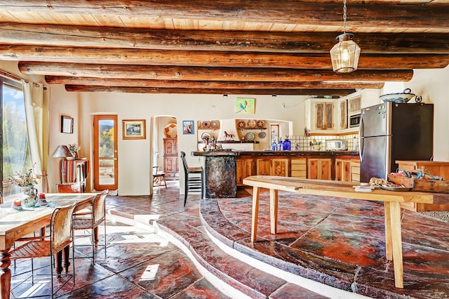 interior space featuring beamed ceiling and wooden ceiling