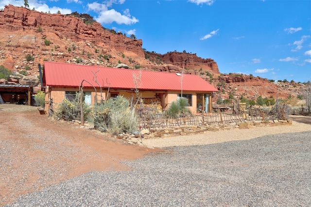 view of front of property with a mountain view