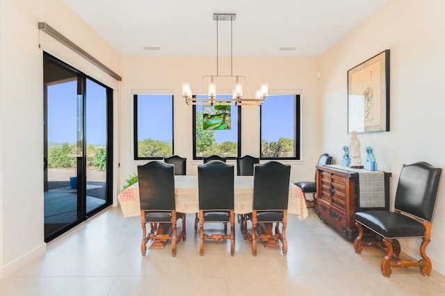 dining space with a notable chandelier