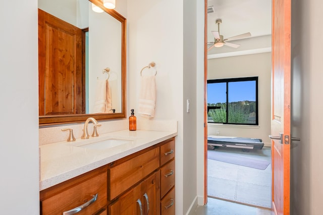 bathroom with ceiling fan and vanity