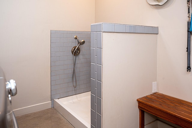 bathroom featuring tiled shower