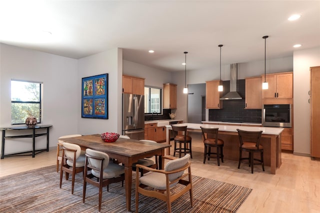 dining area featuring recessed lighting and light wood-type flooring