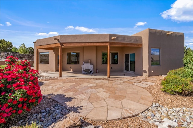 back of property with a patio area