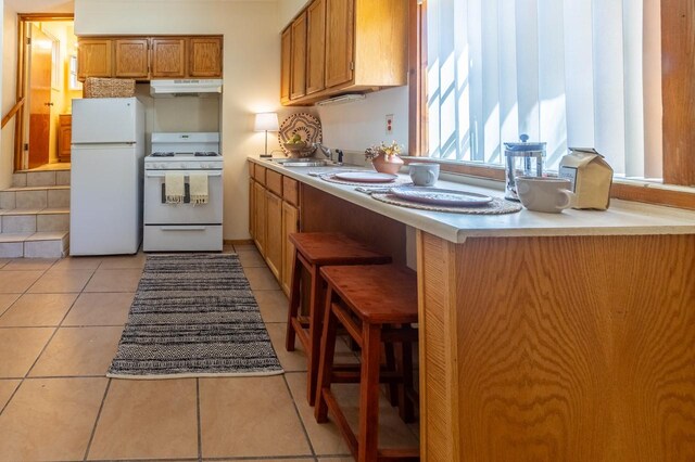 bathroom featuring tile patterned flooring and vanity