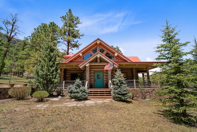 log home with covered porch