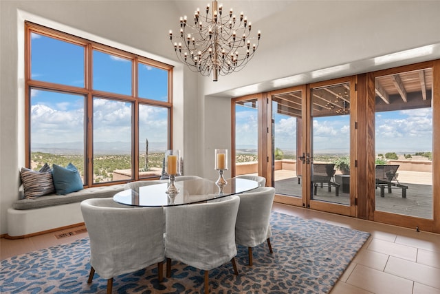 tiled dining area with a high ceiling