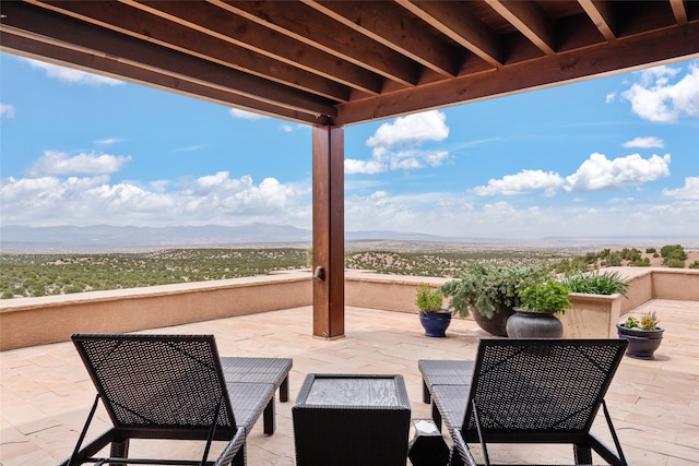 view of patio / terrace with a mountain view