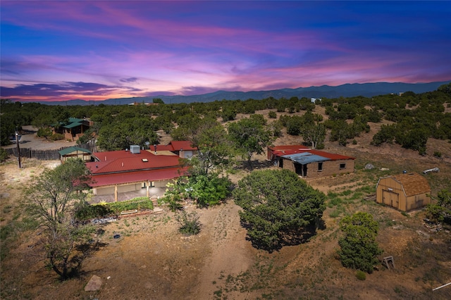 aerial view at dusk with a mountain view