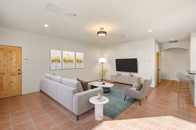 living room with light tile patterned floors