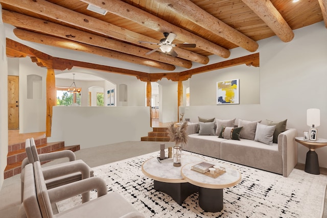 living room featuring beamed ceiling, wood ceiling, and ceiling fan with notable chandelier