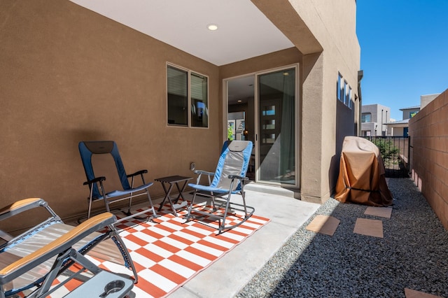 view of patio / terrace featuring area for grilling and fence