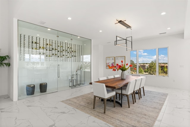 dining space with recessed lighting, visible vents, marble finish floor, and a chandelier