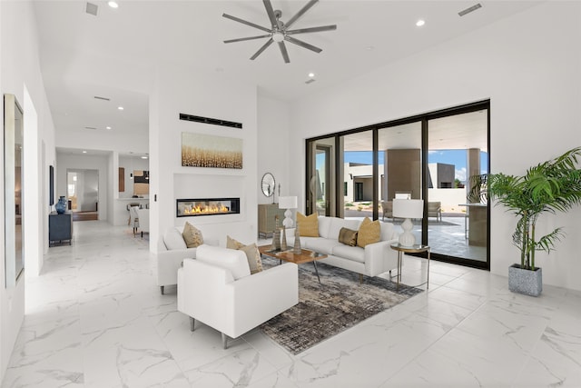 living room with recessed lighting, visible vents, marble finish floor, and ceiling fan