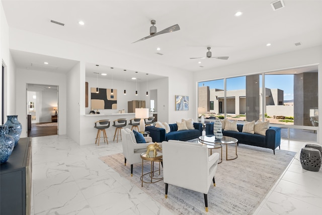 living room with recessed lighting, visible vents, marble finish floor, and a ceiling fan