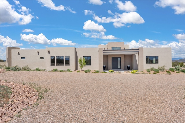 view of front facade featuring stucco siding