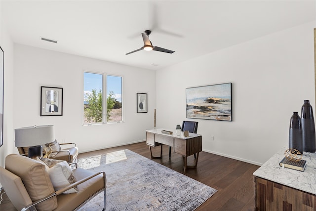 office space featuring visible vents, baseboards, dark wood-type flooring, and ceiling fan