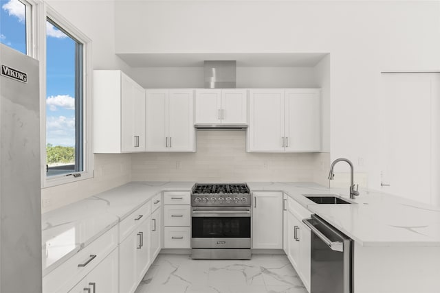 kitchen featuring tasteful backsplash, light tile patterned flooring, stainless steel appliances, light stone countertops, and sink