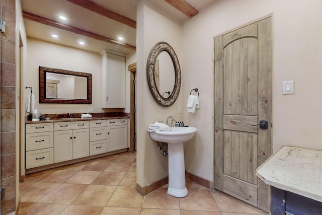 bathroom featuring tile patterned floors and dual sinks