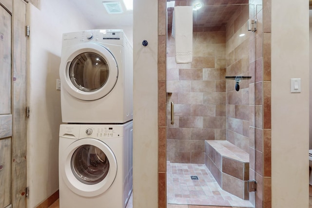 laundry room with stacked washer and clothes dryer