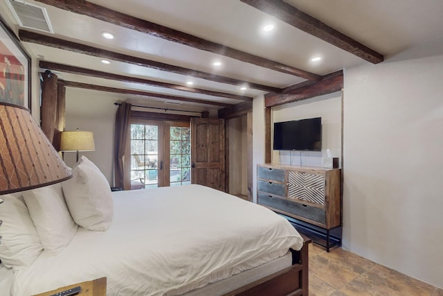 bedroom with french doors and beam ceiling