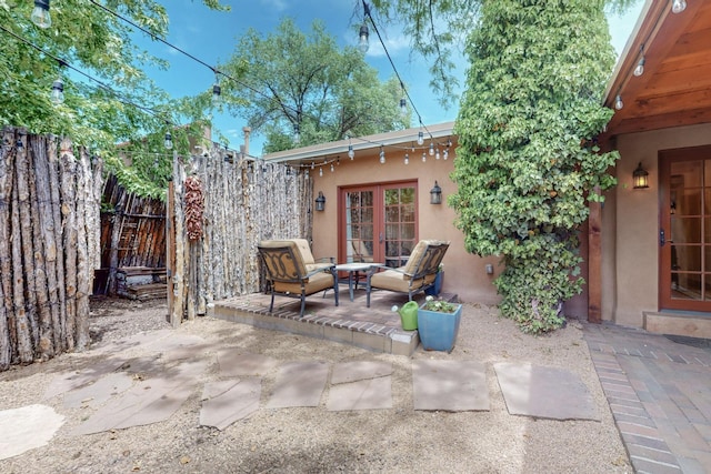 view of patio / terrace with an outdoor living space and french doors