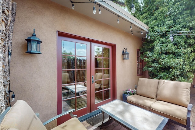 exterior space with rail lighting and french doors