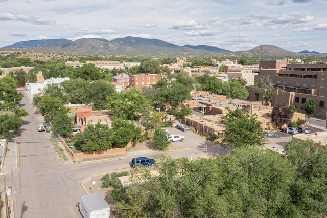 birds eye view of property with a mountain view