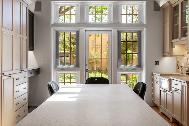 dining area featuring a healthy amount of sunlight and hardwood / wood-style flooring