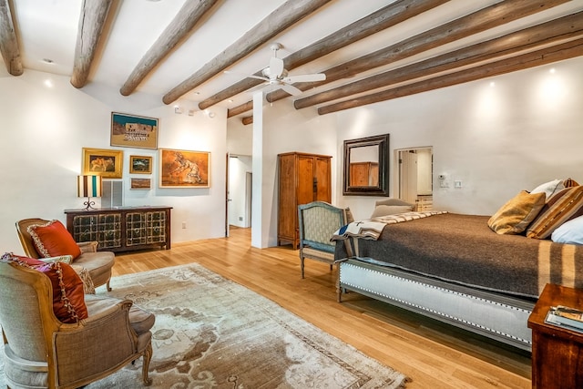 bedroom with beamed ceiling, ceiling fan, and hardwood / wood-style flooring