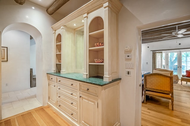 kitchen featuring ceiling fan, light hardwood / wood-style flooring, french doors, and vaulted ceiling with beams