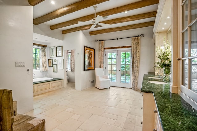 living area featuring french doors, beam ceiling, sink, light tile flooring, and ceiling fan