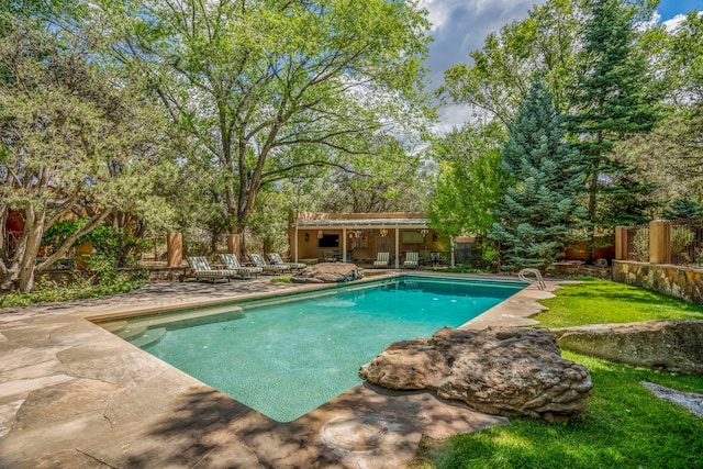 view of pool featuring a patio