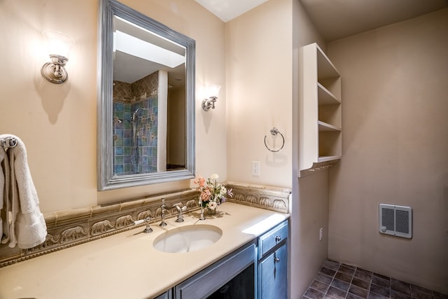 bathroom featuring tile floors and vanity