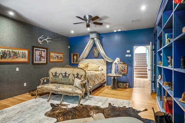 bedroom featuring ceiling fan and hardwood / wood-style flooring