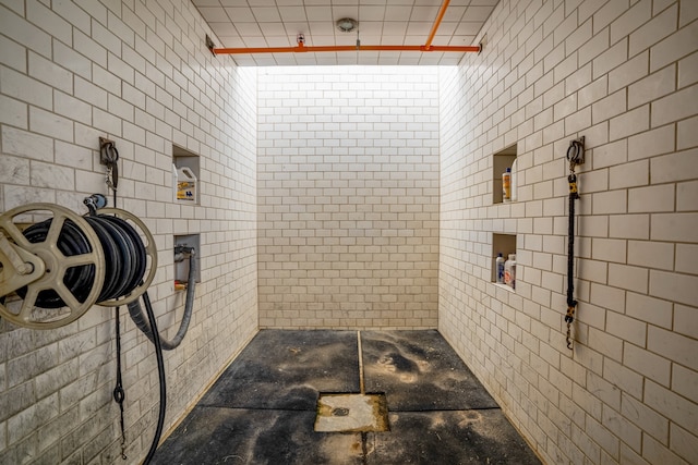 bathroom with tiled shower