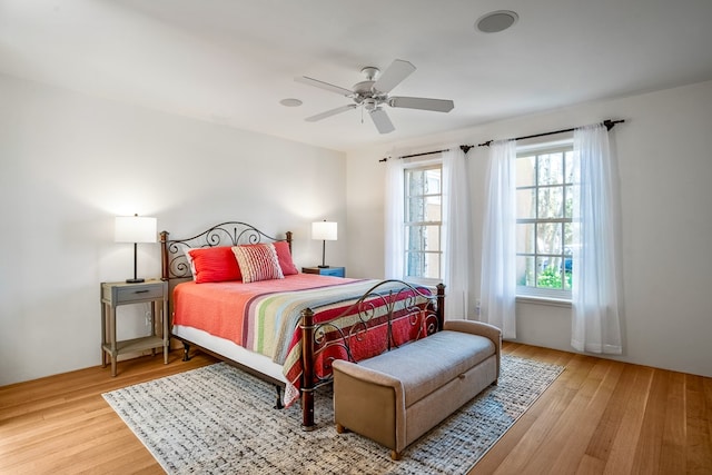 bedroom featuring hardwood / wood-style flooring and ceiling fan