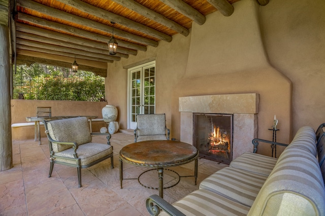 view of patio / terrace featuring an outdoor fireplace