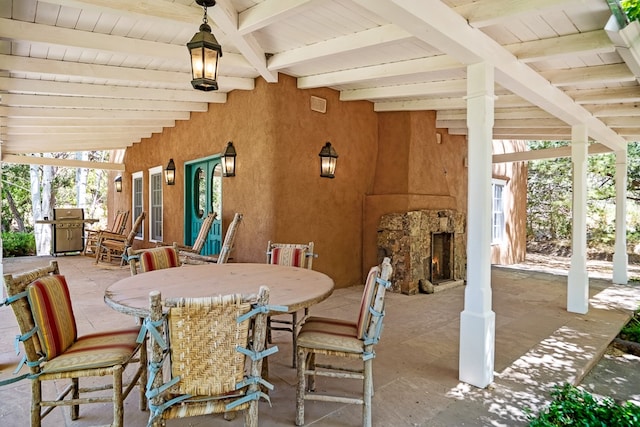 view of patio featuring a grill